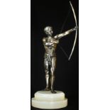 An Art Deco period silvered metal figure, of a scantily clad archer, stepped circular white onyx