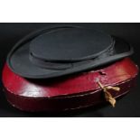 An early 20th century French-made chapeau claque collapsible opera hat, retailed by Hope Brothers,