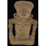 A Central American terracotta figure, in typical Pre-Columbian manner, seated, stylised features,
