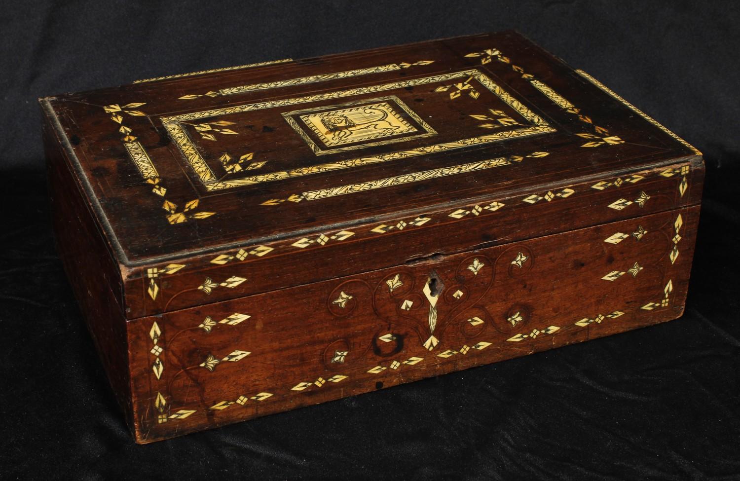 A 19th century Indian hardwood and ivory marquetry rectangular box, hinged cover centred by a