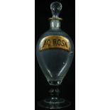 An unusual 19th century tear-shaped apothecary bottle, later inscribed with a pharmacy label,