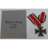 A WWII German Iron Cross 2nd class EK2, three part construction with iron core, in original packet
