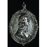King Charles the Martyr - a silver coloured metal commemorative pendant medallion, in relief with
