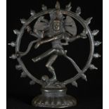 An Indian dark patinated copper alloy shrine figure, cast as Shiva Nataraja, within a jvala mala,