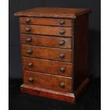 A late Victorian/Edwardian table top watchmaker's chest, oversailing rectangular top above six