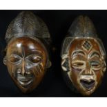 Tribal Art - a Baule mask, elaborate coiffure, scarified features, picked out with white and red