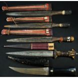 A North-East African knife, 18cm curved blade with armourer's mark, ebonised wooden grip and