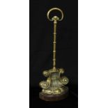 A Victorian brass and cast iron door stop, posted handle, 38.5cm high, c.1880