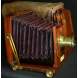 Photography - an early 20th century mahogany and brass field plate camera, by Davidson of London,