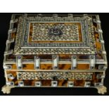 An Indian tortoiseshell and Vizagapatam rectangular sarcophagus box, hinged cover, lion paw feet,