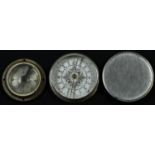 A World War I German artillery compass, 3cm silvered dial inscribed C P Goerz, Berlin, 4.5cm diam