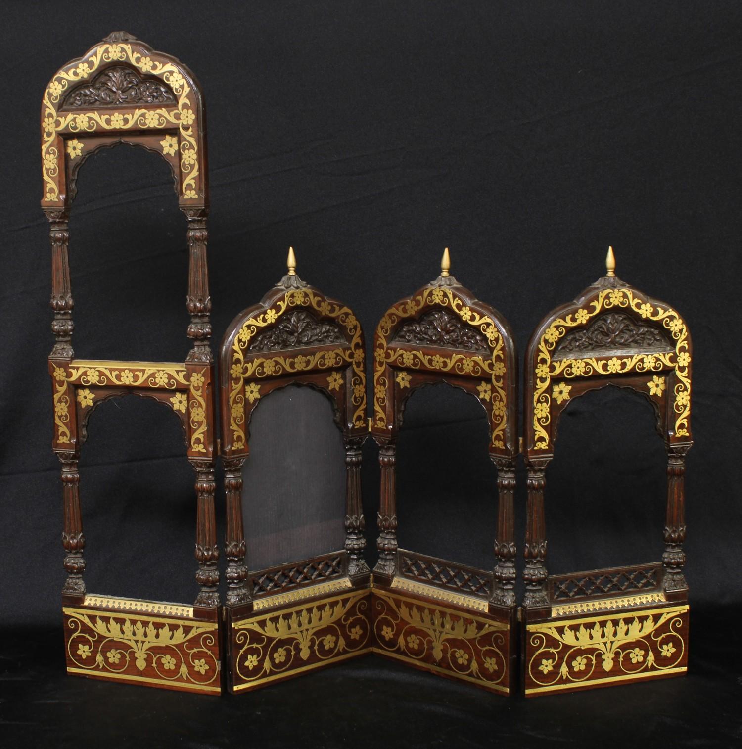 A 19th century Orientalist mahogany and brass marquetry quadriptych graduating photograph frame,