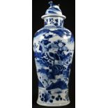 A Chinese baluster vase and cover, painted in underglaze blue with mounted warriors in stylized