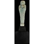 Antiquities - an Egyptian faience ushabti, traces of turquoise glaze, 11cm long