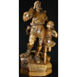 A large 19th century Swiss Grand Tour walnut carving, of William Tell and his son, after the Tell