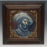 An Italian maiolica panel, painted with a portrait of a bearded gentleman wearing a ruff and a
