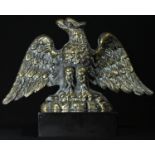 An early 20th century desk weight, cast as an Imperial eagle, marble base, 14cm high