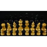 An early 20th century boxwood and ebonised Staunton pattern chess set, the Kings 7.5cm high,