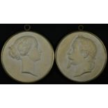 A pair of French plaster portrait roundels, after Jules-Constant Peyre, Napoleon III and Empress