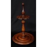Treen - a 19th century mahogany table top church warden pipe stand, shaped support with provision