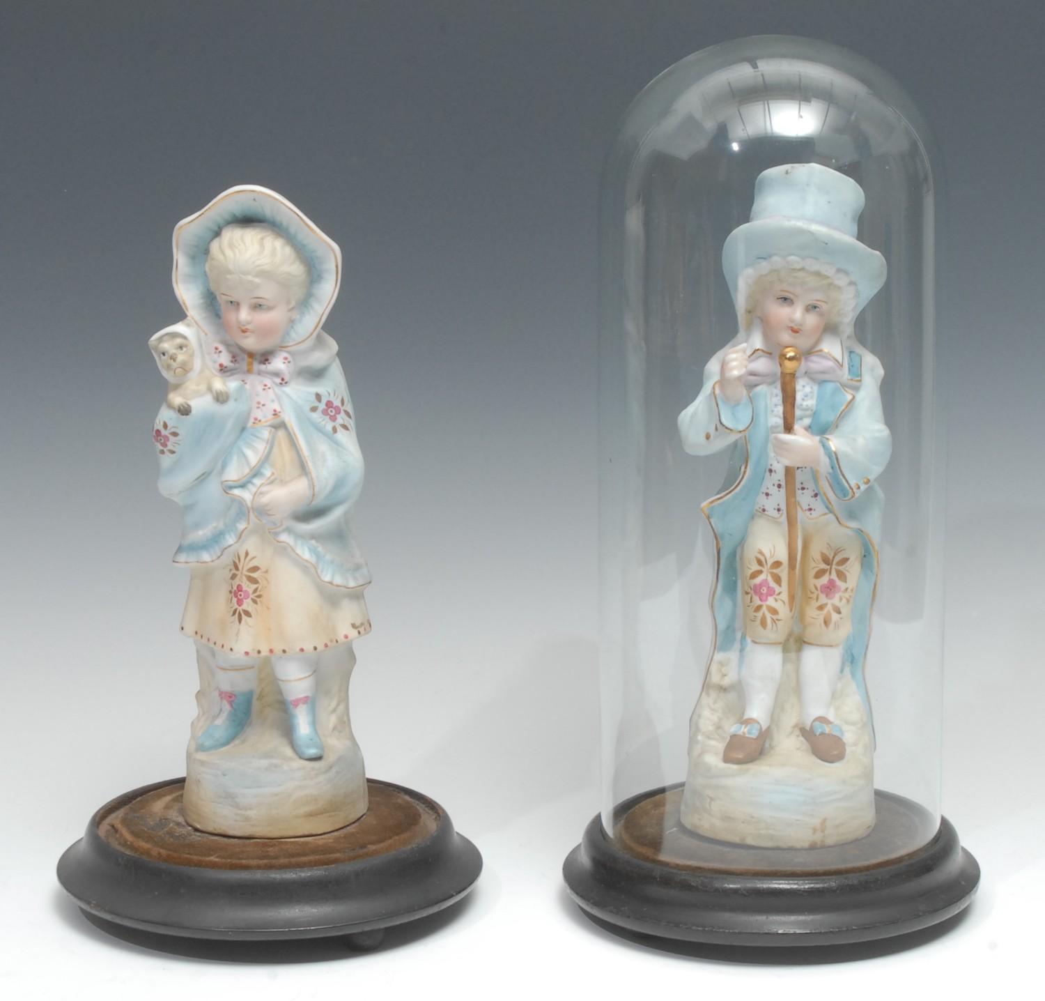 A pair of late 19th century/early 20th century continental bisque figures, of a young girl and boy