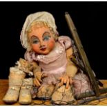 Puppetry - a mid-20th century large marionette puppet, in the form of a baby girl, sculpted and