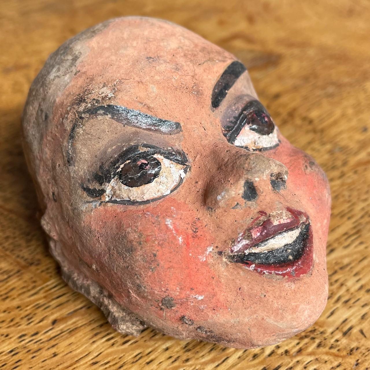 Puppetry - a collection of mid-20th century sculpted painted papier-mâché and carved wooden