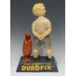 Advertising - a reproduction Durofix painted composition shop display figure of a boy, he stands