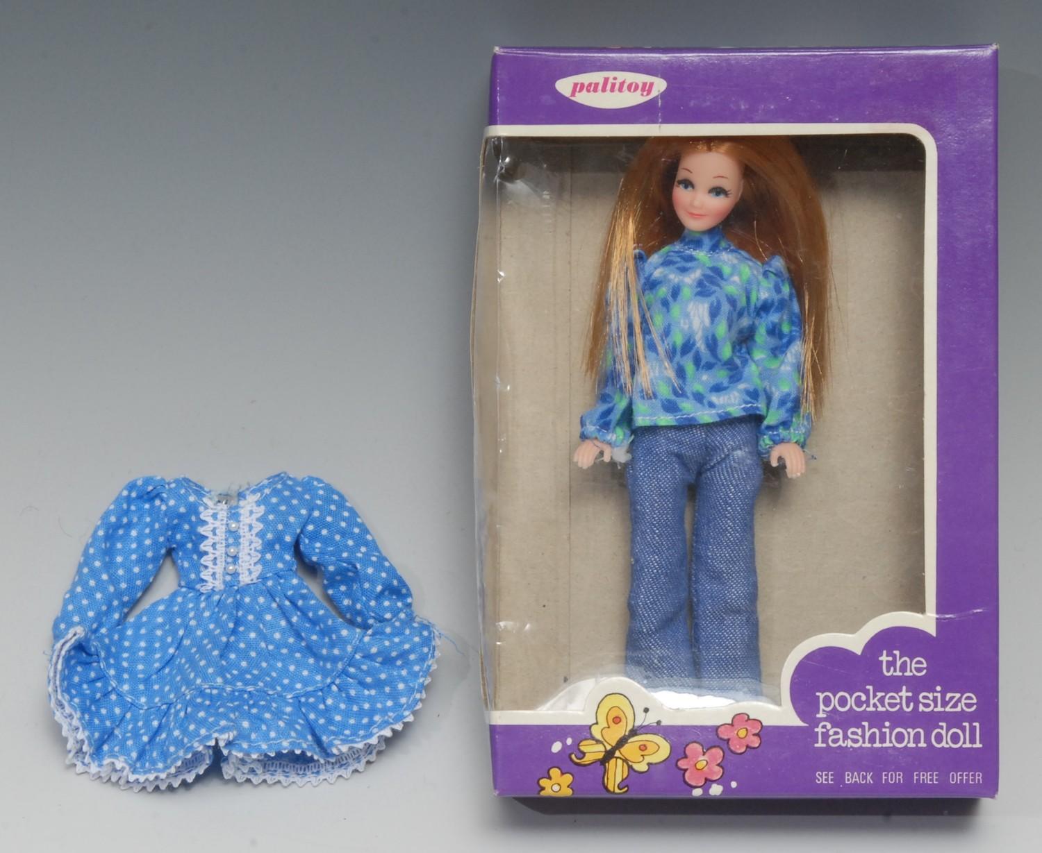 Palitoy Pippa's friend Tammie pocket size fashion doll, red hair, wearing a blue blouse with printed