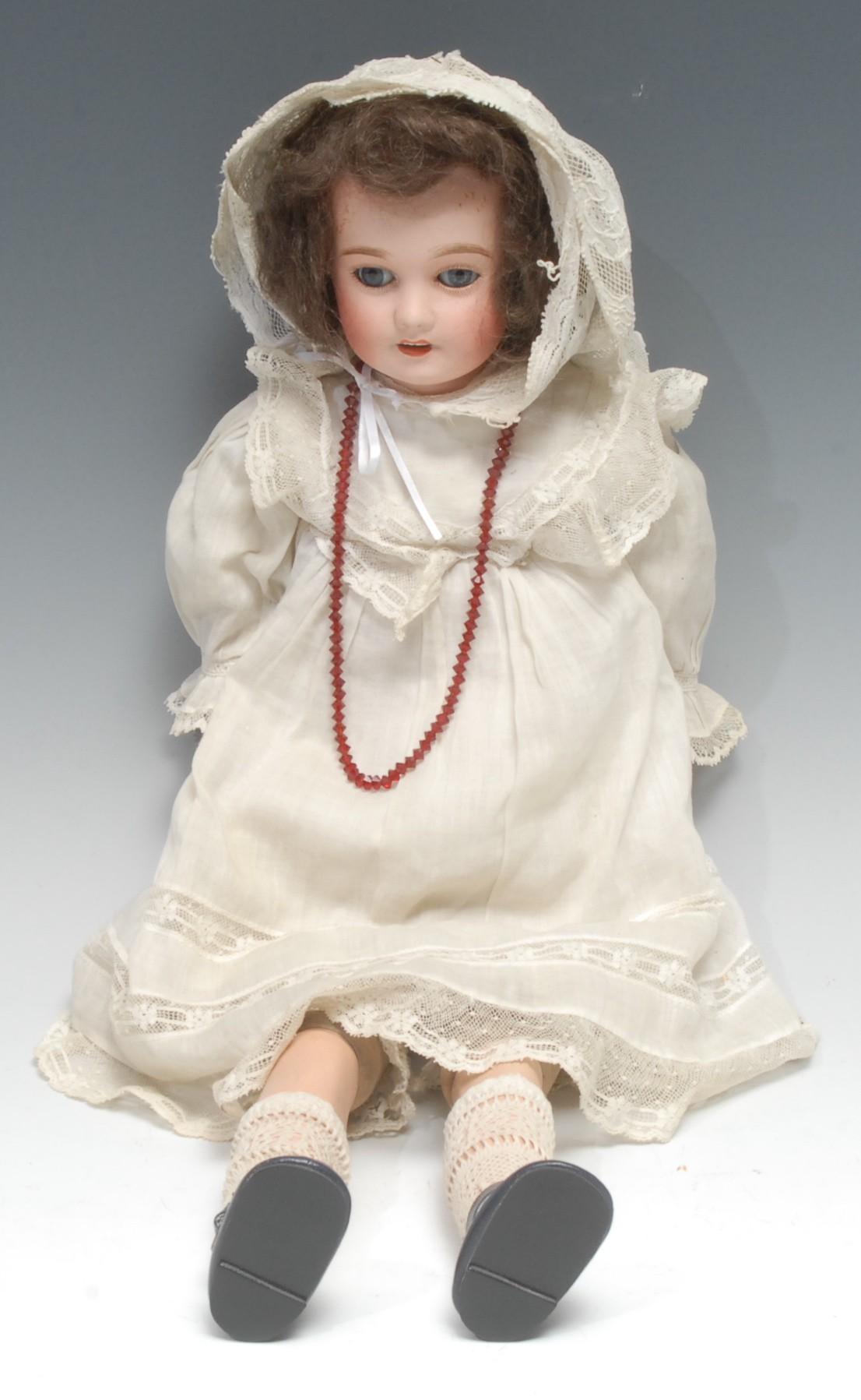 A Lanternier et Cie (France) bisque head and shoulder doll, part painted composition body, brown wig
