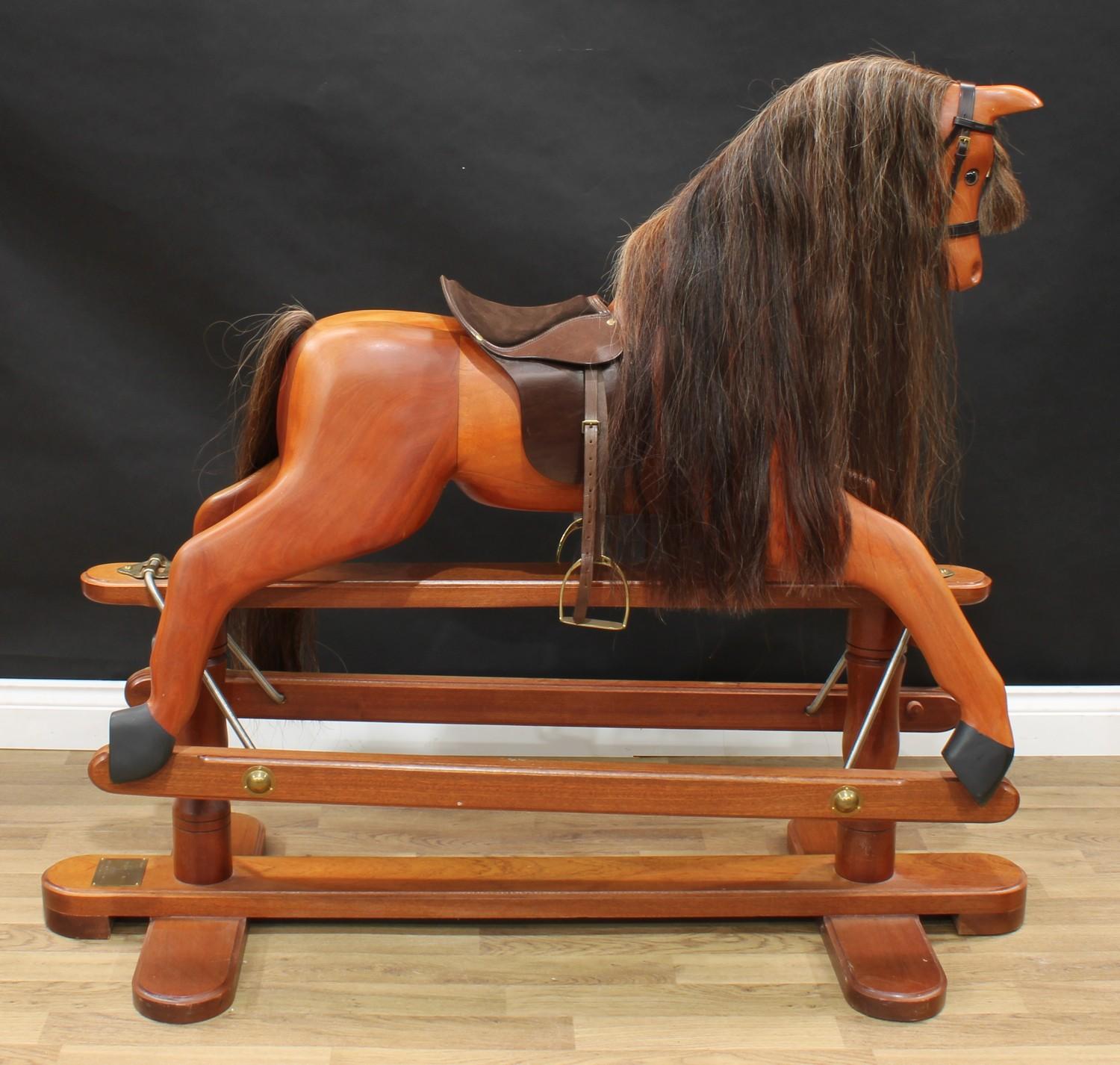 A 20th century House of Marbles (Devon) carved hardwood rocking horse on safety stand, carved - Image 2 of 3