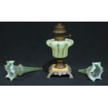 A late 19th century oil lamp, ogee shaped uranium glass reservoir, the stepped base in onyx and base