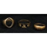 A Victorian gold and black enamel mourning ring, set with three old cut diamond chips, inscribed "In