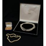 A triple strand cultured pearl choker necklace, the 9ct gold clasp set with blue stones and