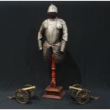 A pair of desk cannon, 19cm wide, 10cm high; a model suit of armour, turned wooden stand, 54cm (3)