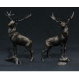 An associated pair of dark patinated bronze stags, by Michael Simpson, naturalistically modelled,