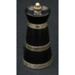 An Edwardian silver mounted and ebony pepper mill, churn shaped, 10cm high, Birmingham 1910