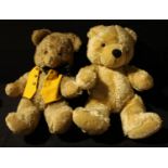 A large 20th century straw filled golden mohair teddy bear with growler, amber and black glass eyes,