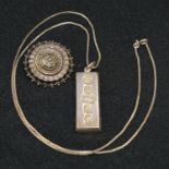 A hallmarked silver ingot pendant and chain; a Victorian silver brooch