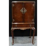 A 1930s Queen Anne style metal mounted walnut and mahogany veneered cocktail/drinks cabinet, pair of