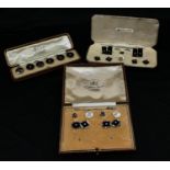 A set of Justice sterling silver and onyx cuff links, collar studs and buttons, cases; a set of