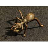 A bronzed metal model of an ant, 5cm long