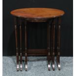 A George III Revival mahogany nest of three oval occasional tables, moulded edge, turned legs, c.