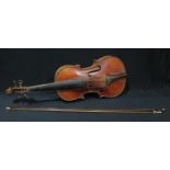 A German violin, two piece back, the interior with paper label stamped Antonius Stradivarius
