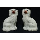 A pair of Stafforshire King Charles Spaniel mantel dogs