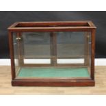 A Victorian mahogany shop counter display cabinet, open rectangular top above a pair of doors,