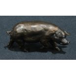 A dark patinated bronze model of a pig, 12cm wide, unmarked