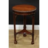 A Chinese Chippendale style occasional table, circular top with foliate gardrooned edge, triform