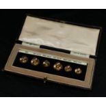 A set of five 9ct gold graduated collar studs, 3.97g, The OP set, patent number 319,947, cased (