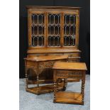 An Old Charm dresser, of 17th century influence, outswept cornice above a pair of glazed doors